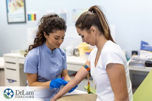 An image of a woman having blood drawn for a test