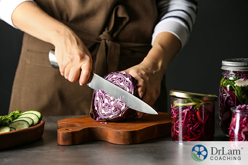 An image of someone slicing purple cabbage to make sauerkraut