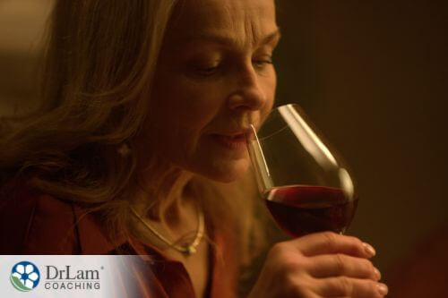 An image of a woman drinking a glass of wine