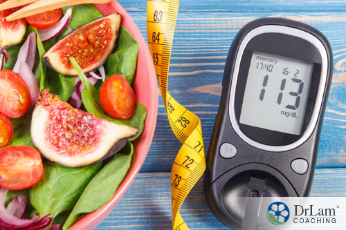 An image of a blood sugar reader and salad with figs