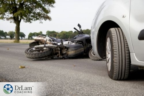 An image of a car and a motorcycle in an accident
