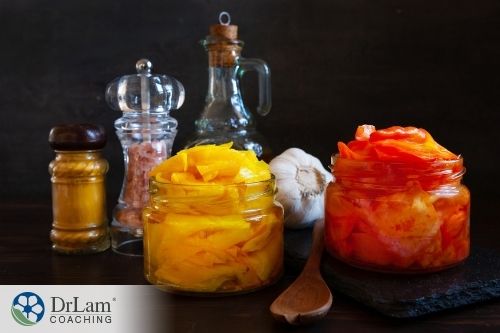 An image of spices and jars of fermented foods