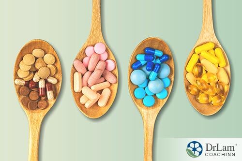 An image of wooden spoons with supplements on them