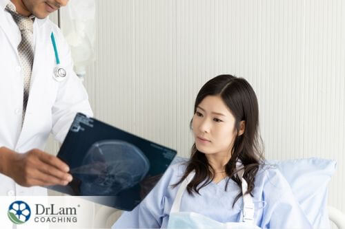 An image of a doctor showing a woman her brain scan film