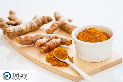An image of turmeric roots and powder