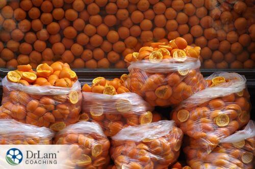 An image of halved oranges in plastic bags