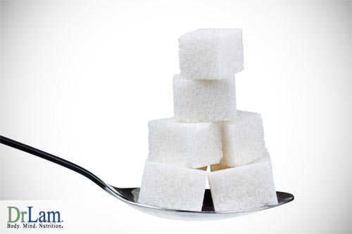 A spoonful of sugar cubes which may harm the body compared to natural healthy sweeteners
