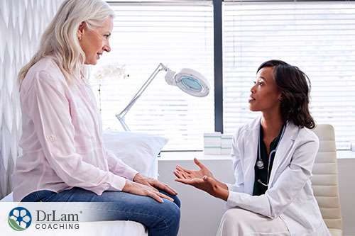 An image of an older woman taking with a doctor