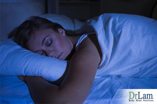A sleeping woman. More peaceful sleep is one of the vitamin B complex benefits.