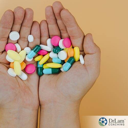 An image of human hands holding supplements