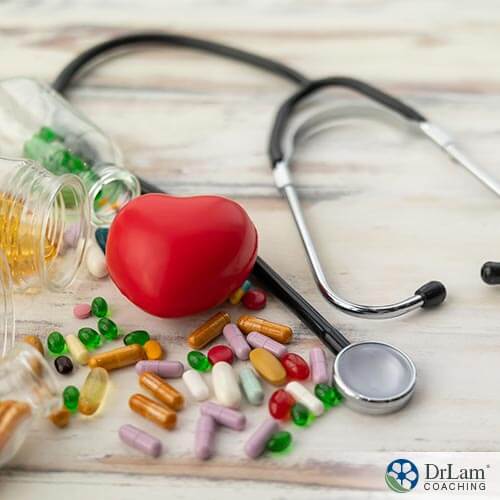 An image of a foam heart with different supplements and a stethoscope around it